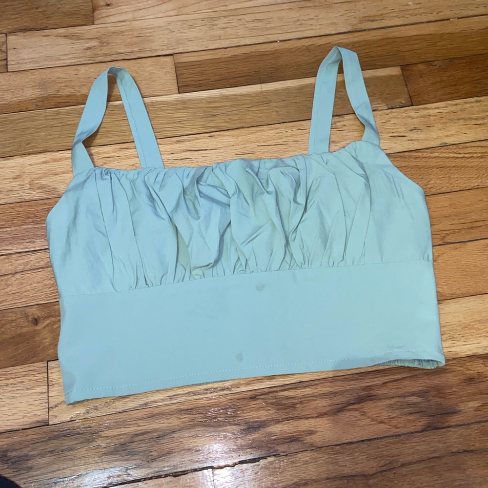 Like green, ruffled center, cropped tank top
